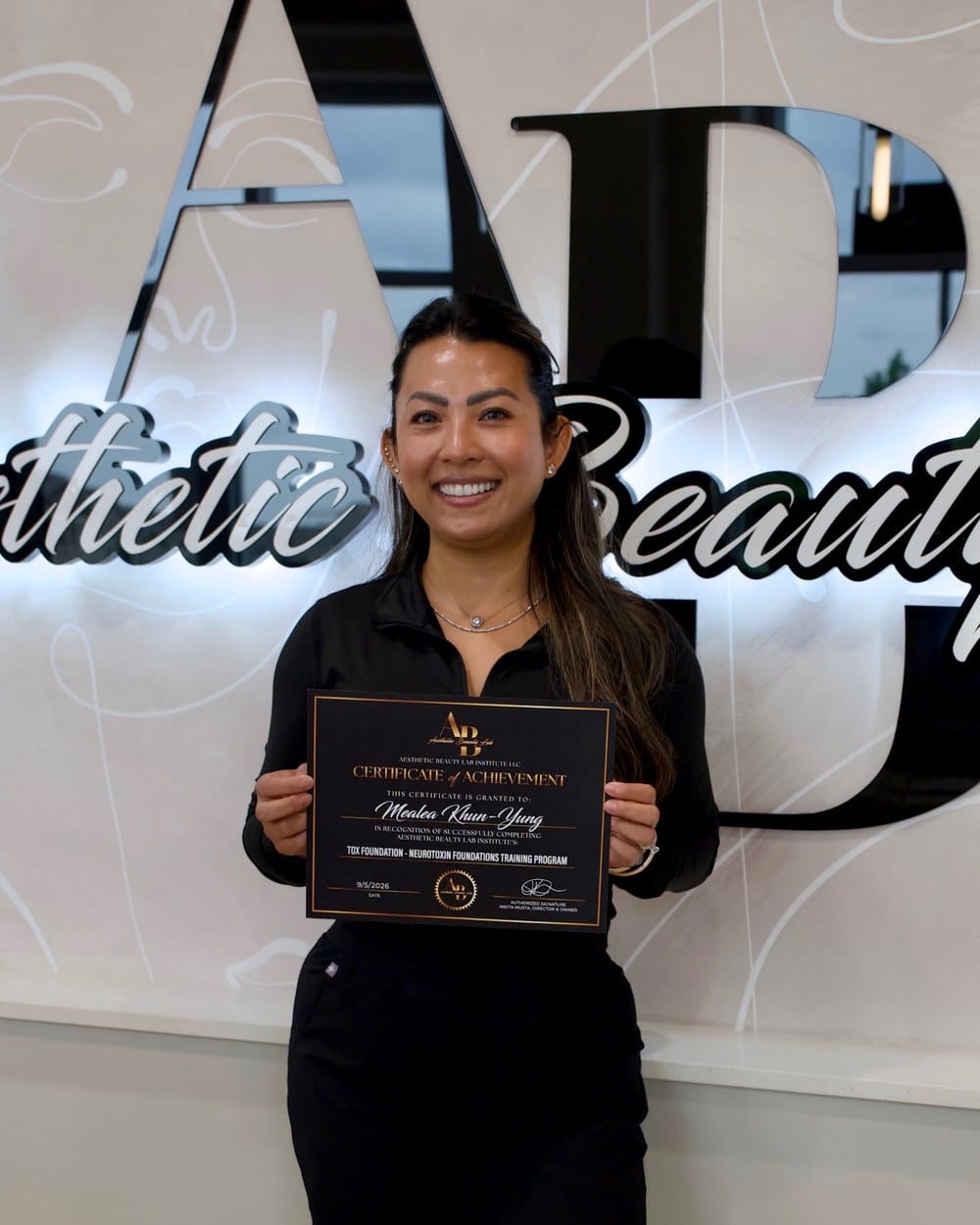 Mealea with her Tox Foundation Certificate of Achievement at ABL Institute, Apple Valley, MN
